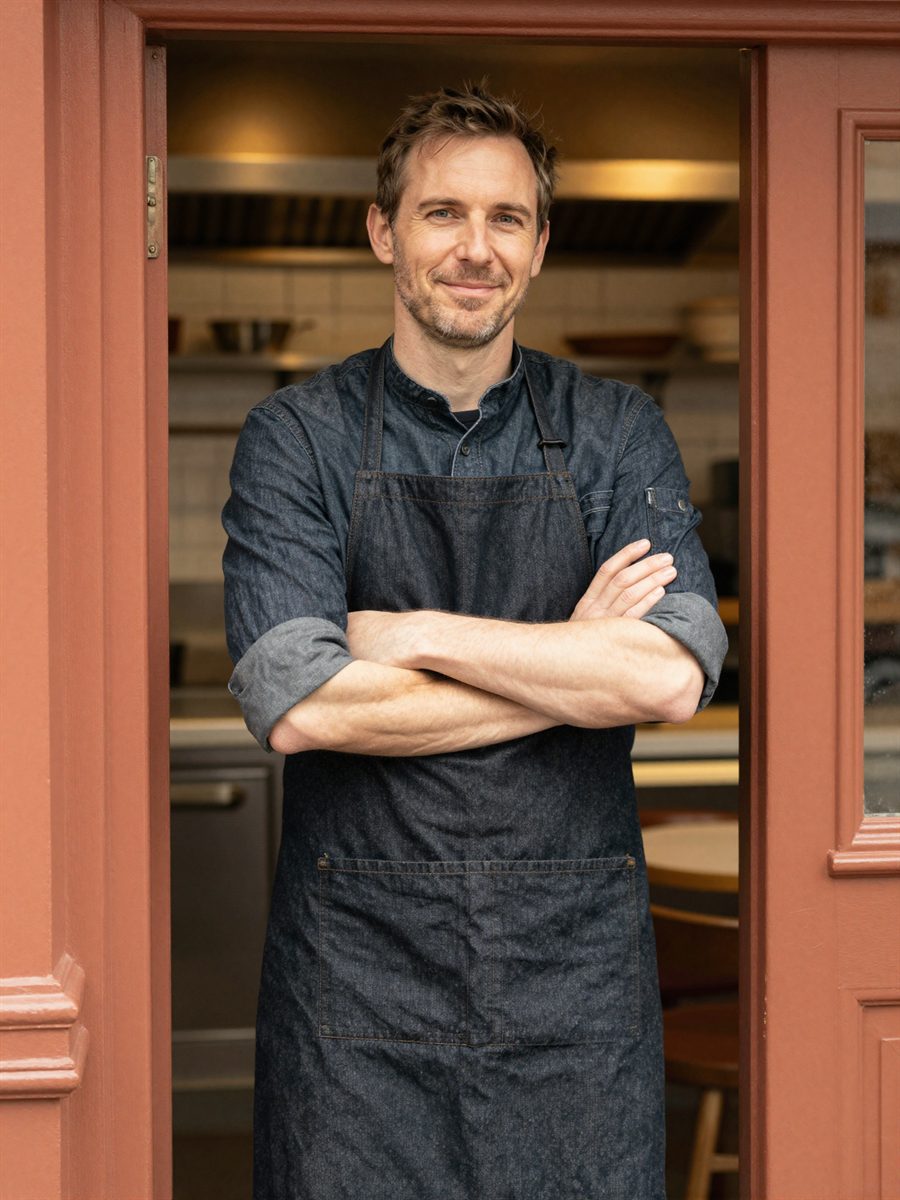 Dan Ellery, chef-owner of Vine & Fig, in the kitchen doorway