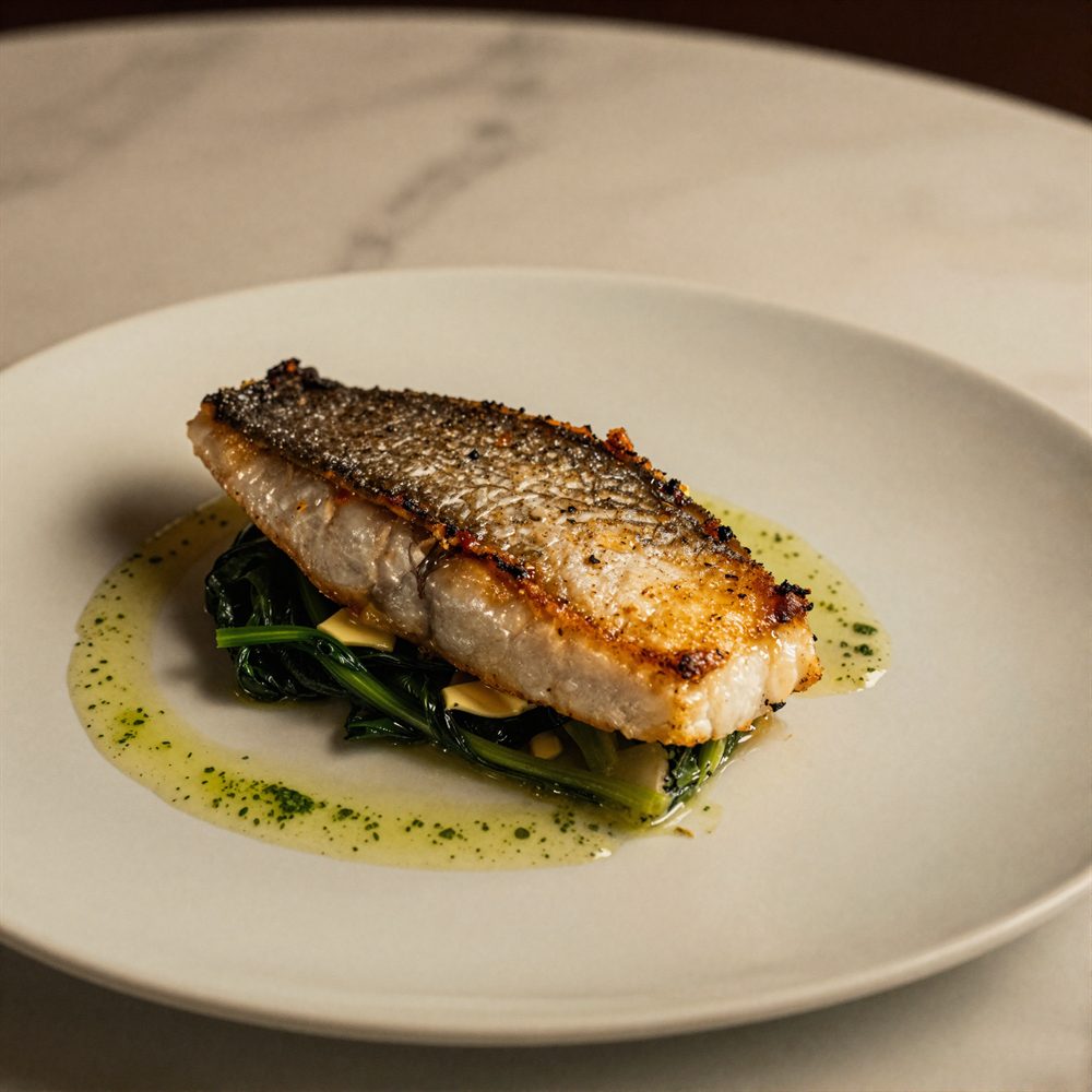 Pan-fried line fish with buttered greens and sea vegetables